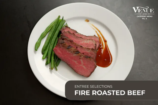 Sliced medium-rare roast beef with green beans and a red sauce on a white plate.